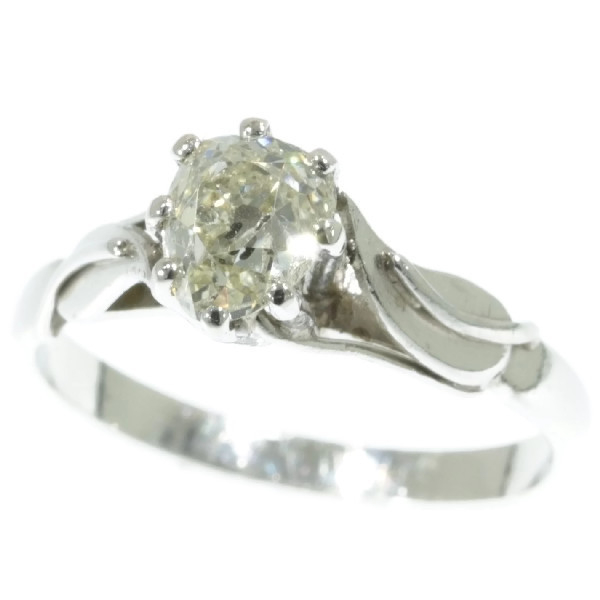 Estate platinum engagement ring with big cushion cut pear shaped diamond